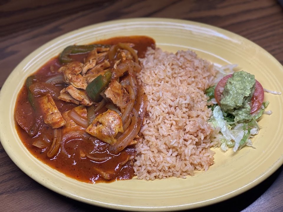 Printed menu with Mexican dishes and breakfast options.