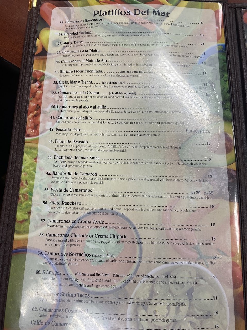 Dessert and burrito selections laid out on a menu.